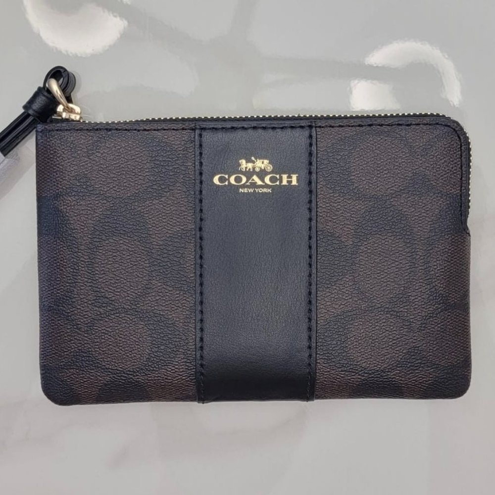 COACH CORNER ZIP WRISTLET IN SIGNATURE CANVAS BLACK/BROWN